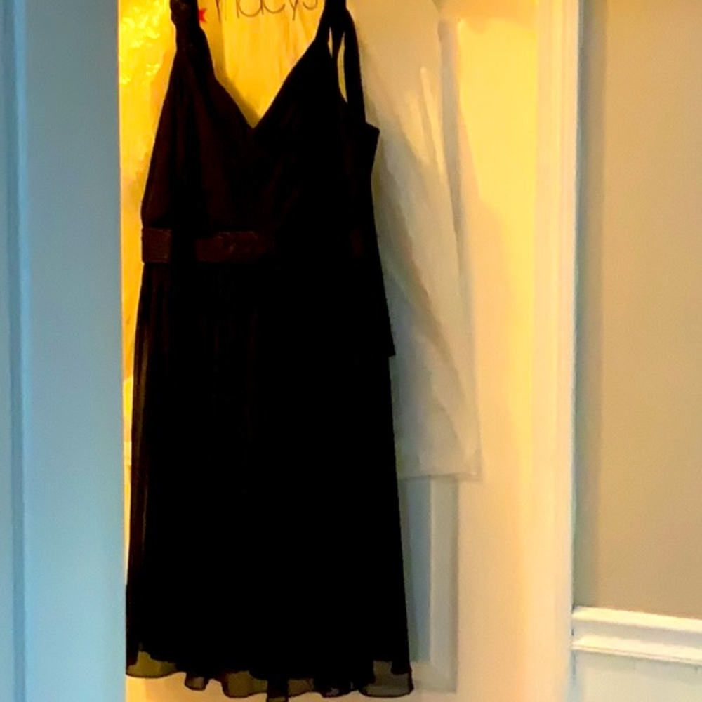 Black cocktail dress w/bronze accents. By R & M   16 W